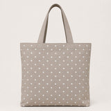 Canvas with white polka dots on a beige background - Ribes y Casals
