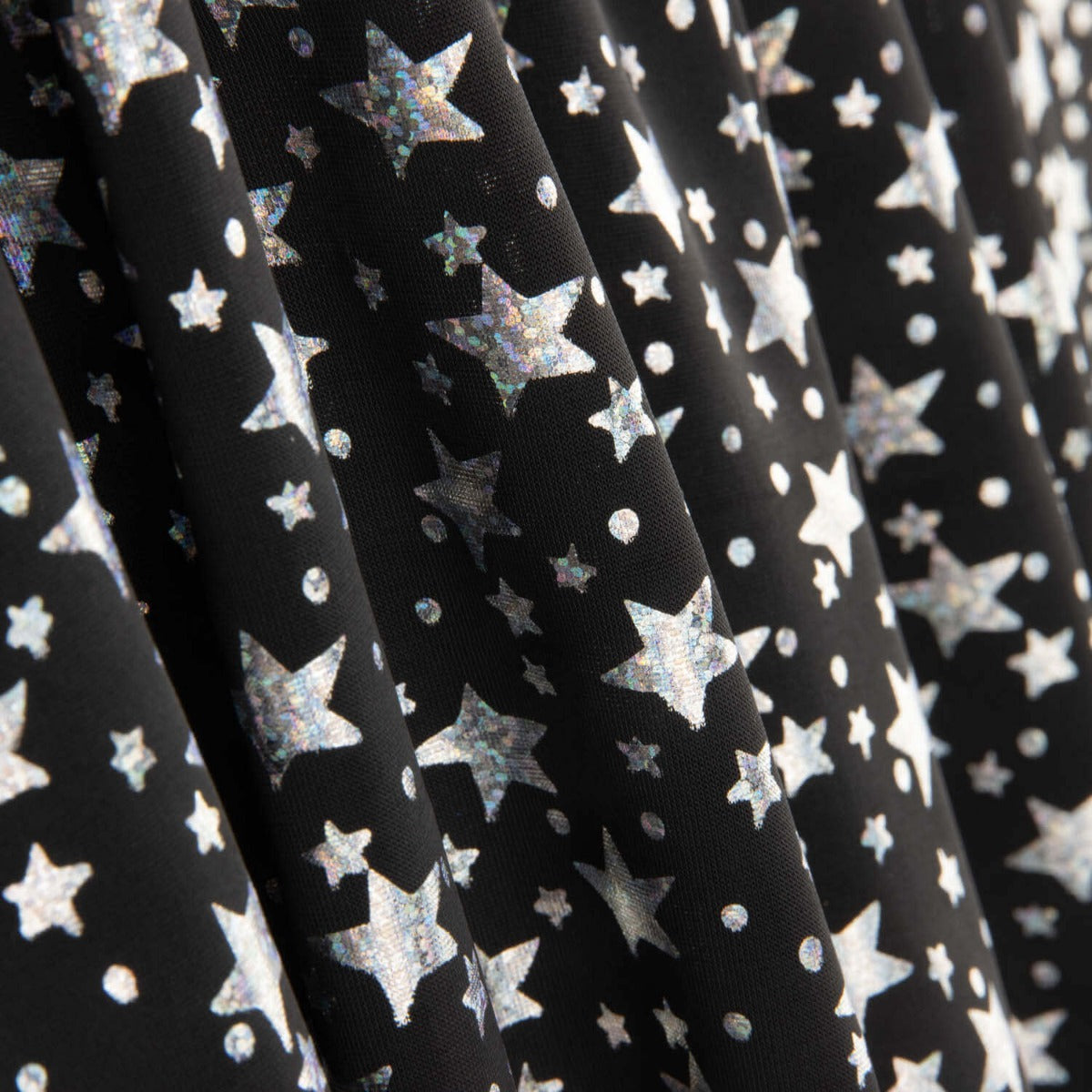 Metallic Printed Stretch Fabric – Iridescent Silver Stars - Ribes y Casals